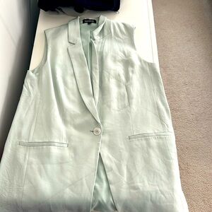 Sleeveless blazer size medium.